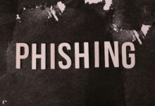 Abstract representation of phishing with the text on a textured dark surface.