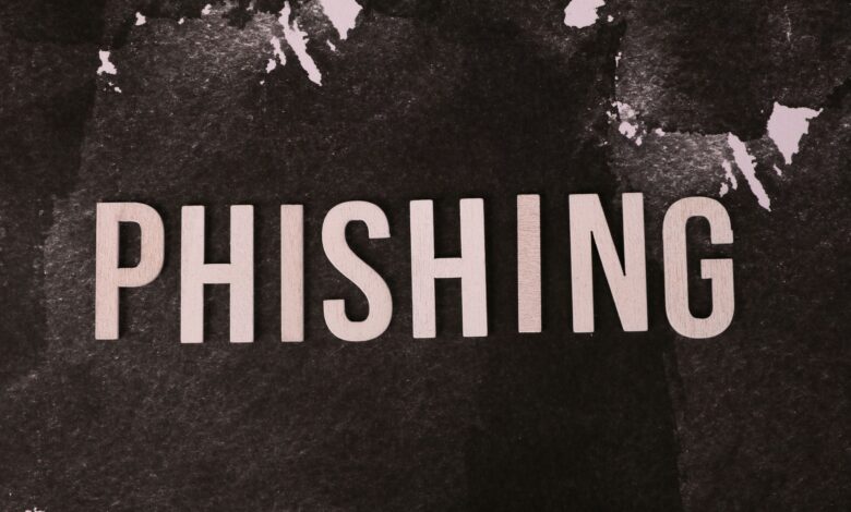 Abstract representation of phishing with the text on a textured dark surface.