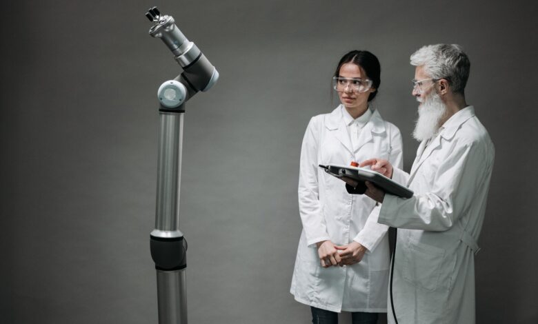 Researchers working with advanced robotics technology in a laboratory setting.