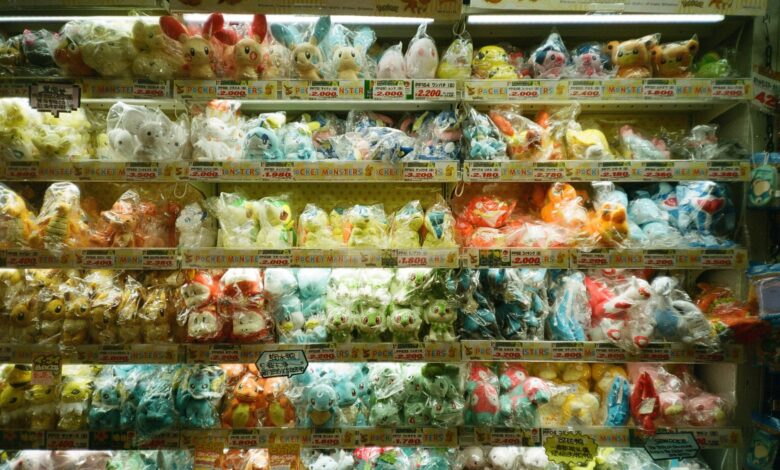 Vibrant collection of assorted plush toys packaged neatly on store shelves.