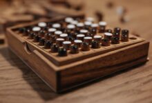 Detailed view of a wooden board game with black and white pieces, symbolizing strategy and leisure.