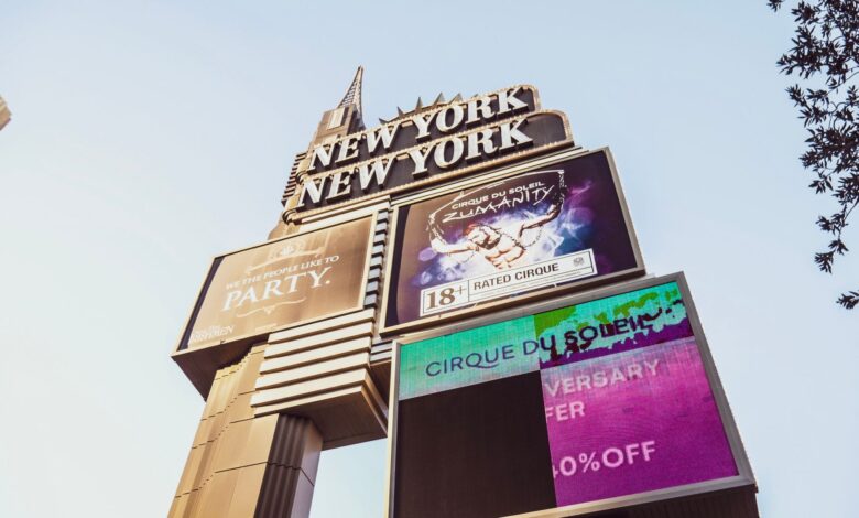 Iconic New York New York casino sign on the Las Vegas Strip showcasing Cirque du Soleil promotion.