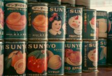 Nostalgic display of vintage Japanese SUNYO brand canned fruits. Perfect for retro and vintage-themed projects.