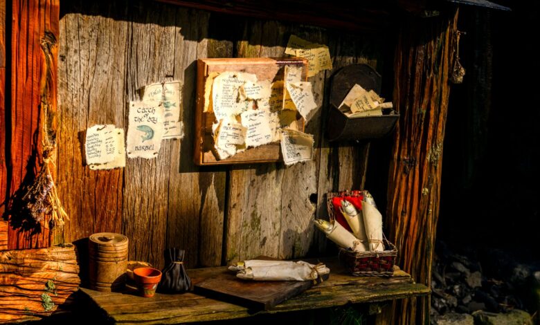 Charming rustic setup with scrolls and notes in Hobbiton, New Zealand.