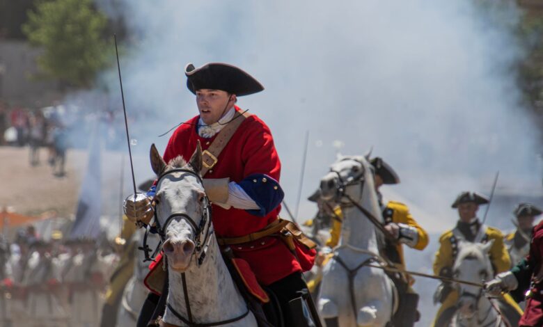Dramatic cavalry charge during a historic military reenactment in Almansa, Spain.