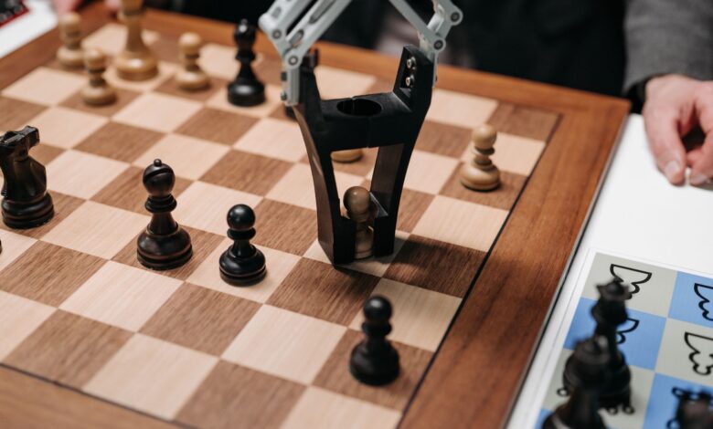 Robotic arm playing a strategic chess game on a wooden board, showcasing technology and innovation.