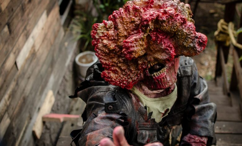 A detailed zombie cosplay costume depicting horror elements in an outdoor setting.