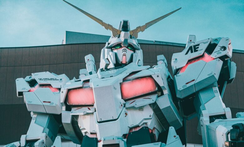 Striking view of a giant robot sculpture with vibrant LED accents in an urban setting.