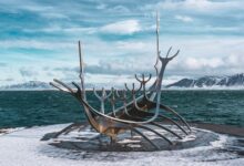 The iconic Sun Voyager sculpture on Reykjavik's snowy shore during winter.
