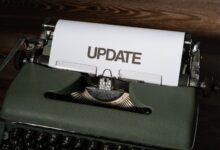 A close-up of a classic typewriter with a sheet displaying 'UPDATE' text, evoking nostalgia.