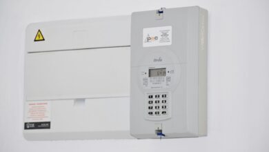 Electrical meter and fuse box on a white wall in Cape Town, South Africa, for energy monitoring or billing.