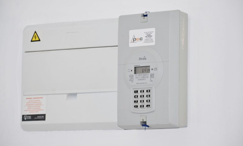Electrical meter and fuse box on a white wall in Cape Town, South Africa, for energy monitoring or billing.