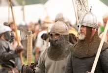 Men in Viking armor participate in a reenactment event in Szczecin, Poland.