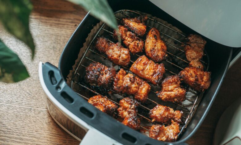 Delicious crispy chicken pieces cooked perfectly in a modern air fryer, ready to serve.