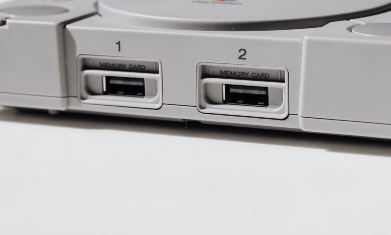 Detailed view of vintage PlayStation console featuring memory slots, capturing nostalgia.