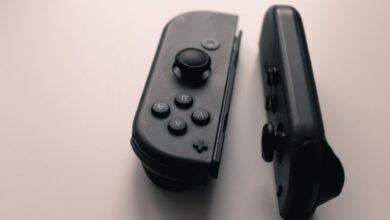 A close-up image of two Nintendo Switch Joy-Con controllers on a neutral background.