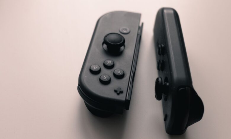 A close-up image of two Nintendo Switch Joy-Con controllers on a neutral background.