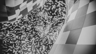 Abstract image featuring a black and white checkered pattern with pixelated forms.