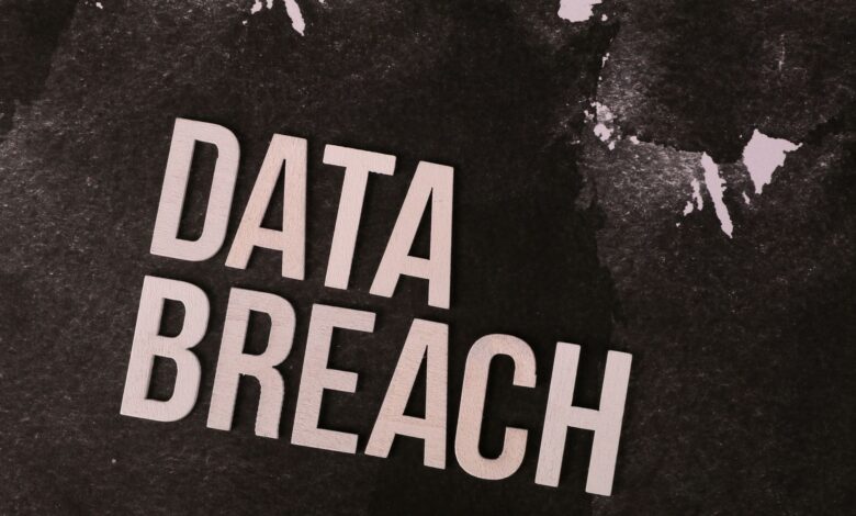 A conceptual image highlighting the issue of data breaches, featuring bold text on a textured background.
