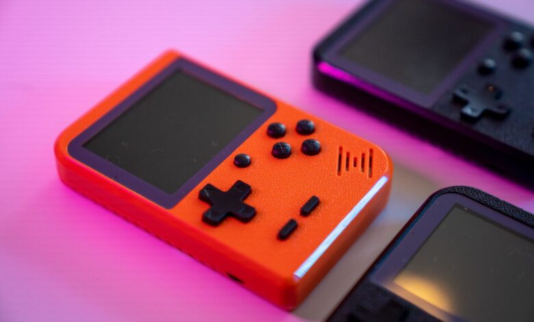 Vibrant and nostalgic handheld gaming console in focus, showcasing retro design with a pop of color.