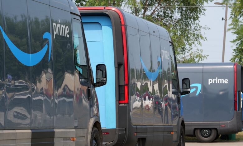 Amazon Prime delivery vans lined up for logistics operations in an urban setting.