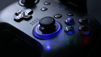 Detailed shot of a gaming controller with glowing LED lights, perfect for tech enthusiasts.