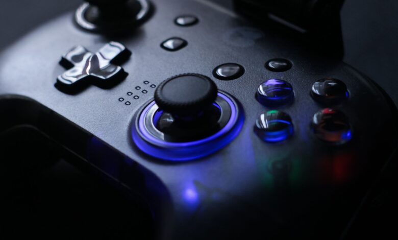 Detailed shot of a gaming controller with glowing LED lights, perfect for tech enthusiasts.