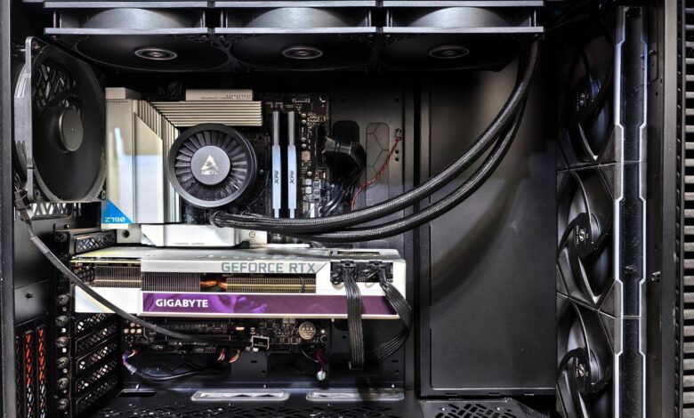 Interior view of a gaming PC showcasing a GeForce RTX graphics card and high-performance cooling system.