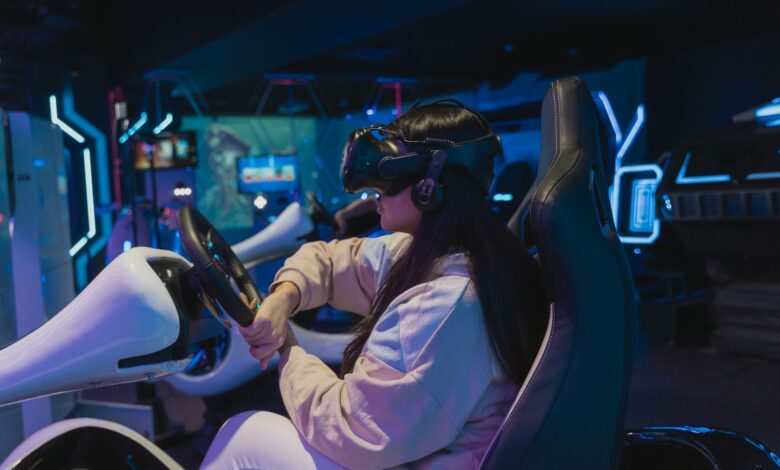 Young woman immersed in a virtual reality racing game in a futuristic setting.