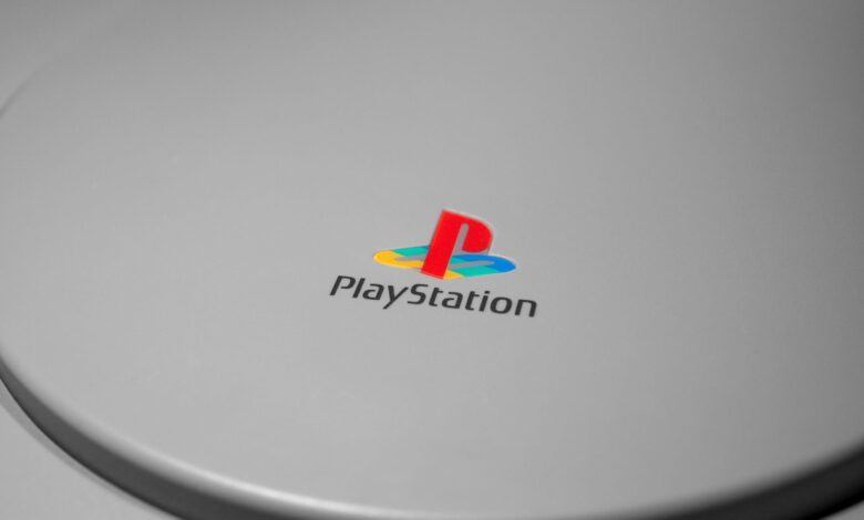 Detailed close-up of iconic PlayStation console logo, perfect for gaming-related content.