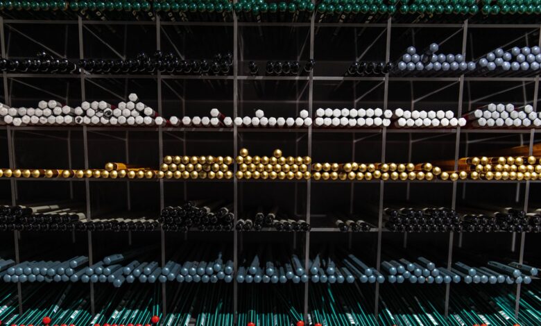 Vibrant assortment of pencils neatly arranged on store shelves, showcasing a variety of colors.