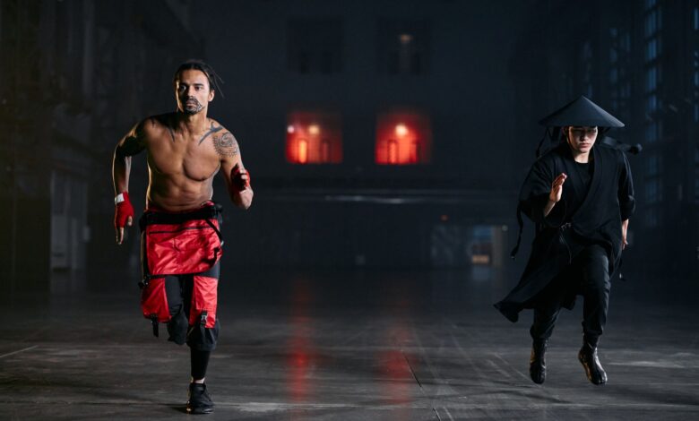 Two men in cosplay costumes running indoors, capturing a dramatic and intense scene.