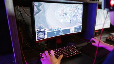 Engaging in an online gaming session with a modern setup, highlighting technology and recreation.