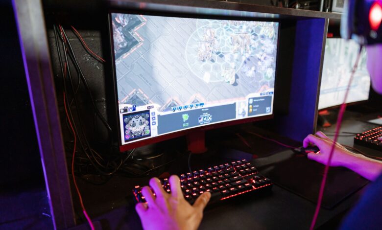 Engaging in an online gaming session with a modern setup, highlighting technology and recreation.