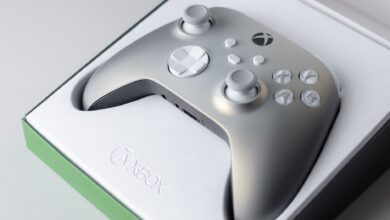 A high-quality close-up of an Xbox game controller in its packaging box, ready for gaming.