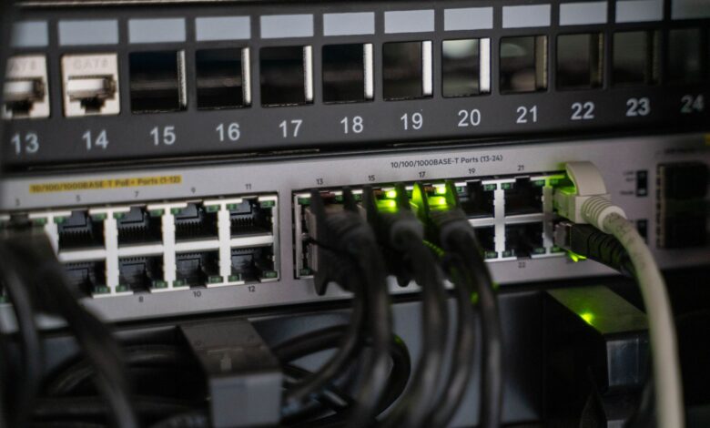 Networking equipment with connected cables, showcasing modern technology infrastructure.