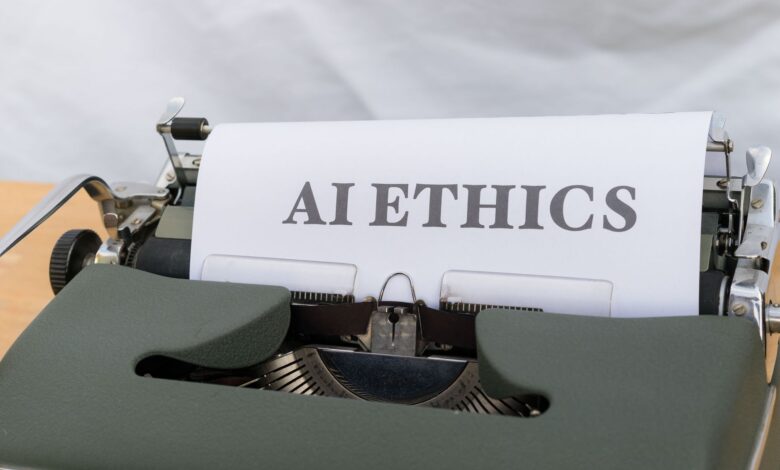 Close-up of vintage typewriter with 'AI ETHICS' typed on paper, emphasizing technology and responsibility.