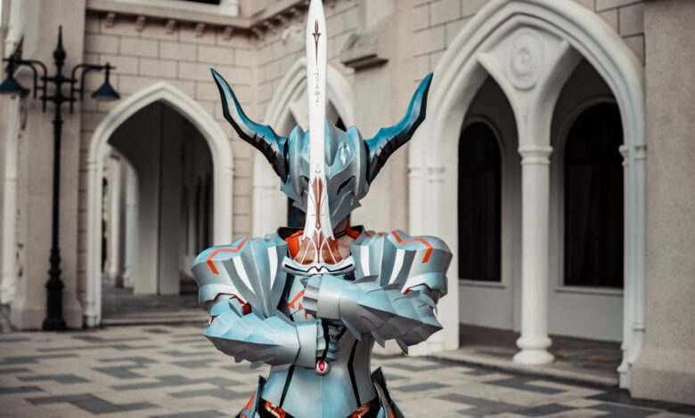 A person in detailed fantasy armor holding a sword in front of an architectural backdrop, creating a dramatic atmosphere.