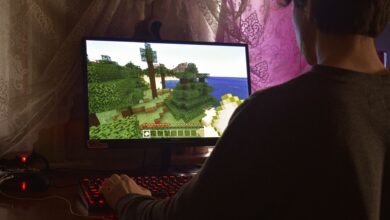 A young man intensely playing a PC video game indoors. Capturing the essence of technology and concentration.