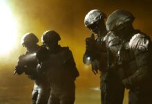 Four soldiers in tactical gear advancing in a smoky battlefield setting.