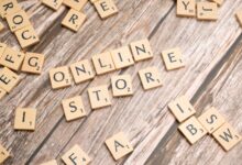 Scrabble tiles spelling 'online store' on a rustic wooden background.