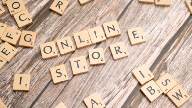 Scrabble tiles spelling 'online store' on a rustic wooden background.