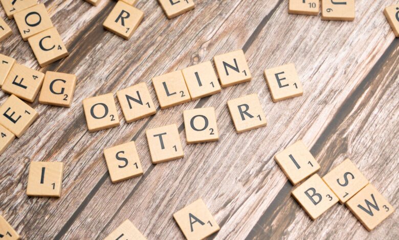 Scrabble tiles spelling 'online store' on a rustic wooden background.