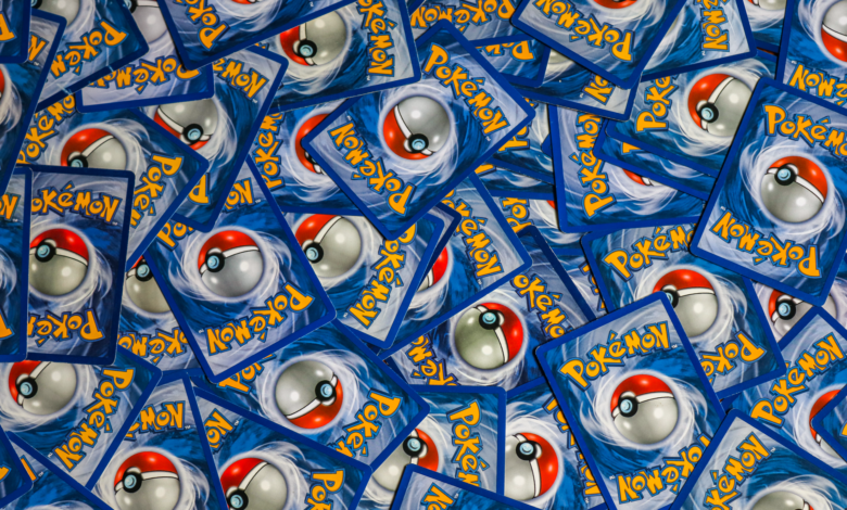A vibrant collection of Pokemon trading cards featuring iconic Pokeball design and Pokemon logo.