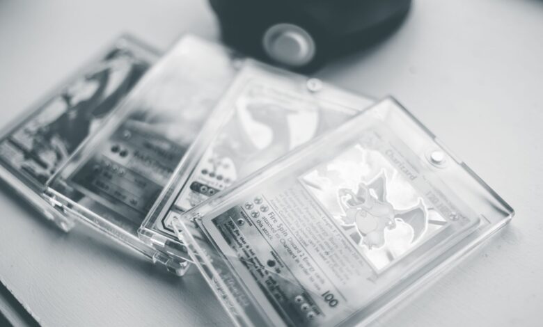 Close-up of collectible Pokemon cards in protective cases, emphasizing preservation and value.