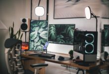 Stylish gaming and streaming setup with dual monitors, PC, and accessories.