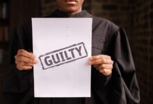 A judge in a courtroom holding a paper with a guilty verdict, symbolizing law and justice.