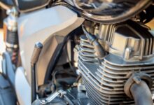 Detailed view of motorcycle engine, showcasing intricate mechanical parts. Ideal for automotive enthusiasts.