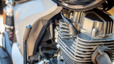 Detailed view of motorcycle engine, showcasing intricate mechanical parts. Ideal for automotive enthusiasts.