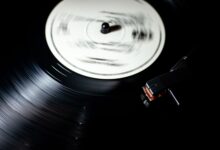 Close-up of a vintage vinyl record spinning on a turntable.